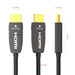 Directional fiber optic HDMI cable with clearly labeled SOURCE and DISPLAY connectors for correct installation in home theater systems.